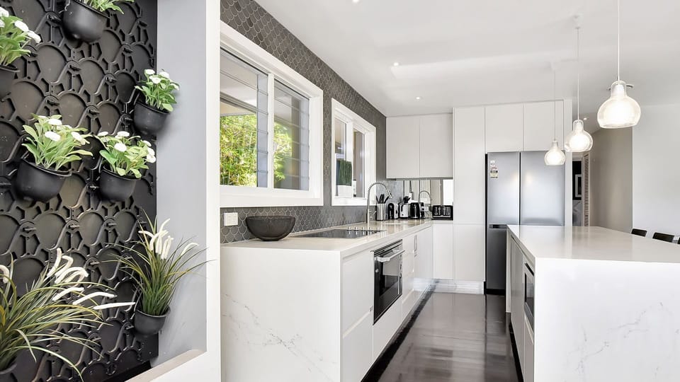 Vertical planted feature wall beside the kitchen for a fresh vibe.