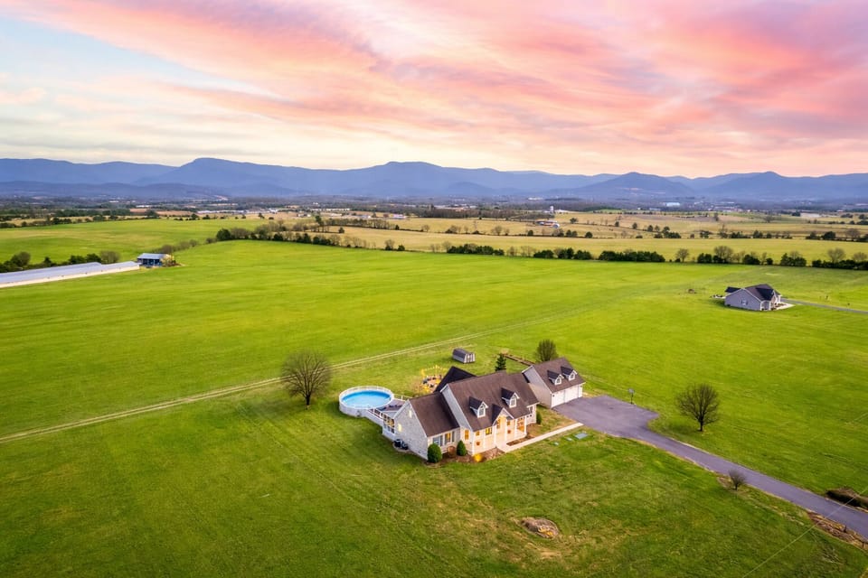 Above-ground pool, Blue Ridge backdrop. No neighbors, no noise—just your group and the mountains.