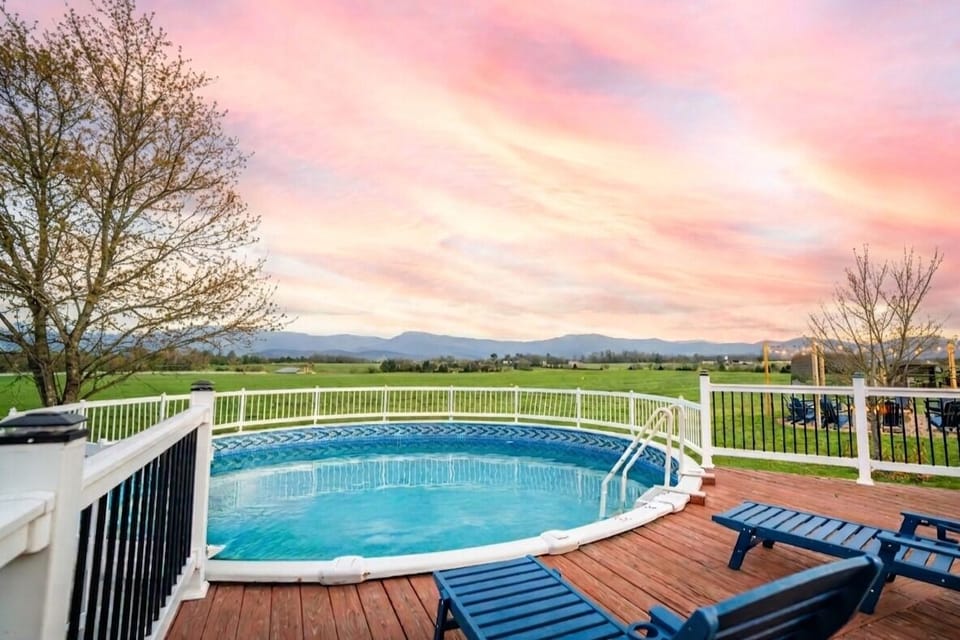 Private above-ground pool with deck access and mountain vistas. Swim laps or float—the views make both better.