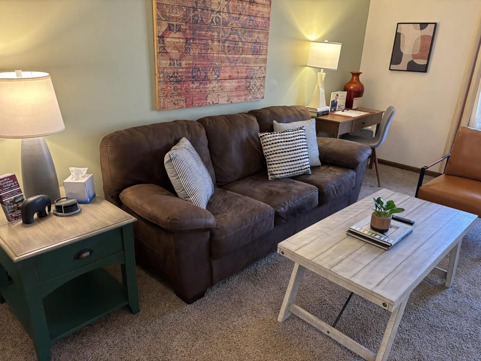 Cozy living room with plush seating and warm lighting