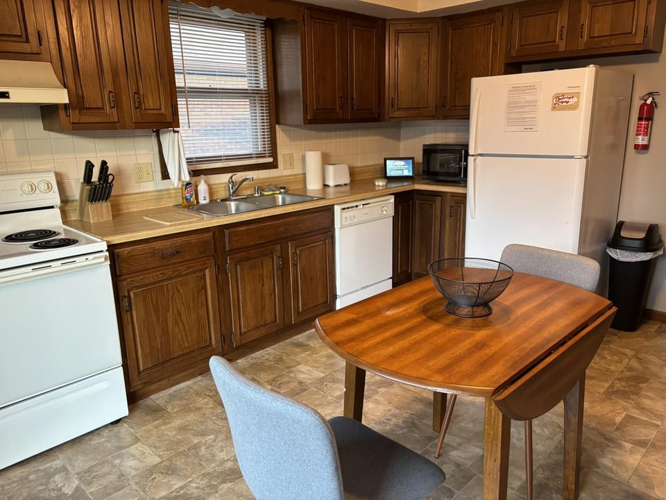 Cozy kitchen with warm wood cabinets and dining nook
