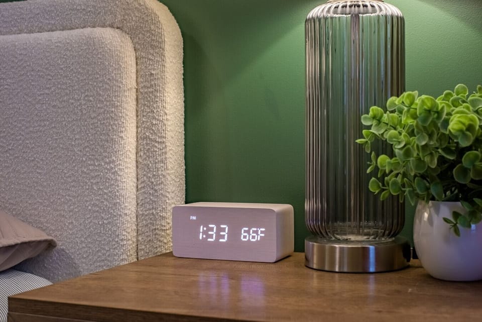 Primary King Suite Detail: Enjoy modern conveniences like the digital clock and USB charging ports on the nightstand—we ensure you have everything needed for a comfortable stay!