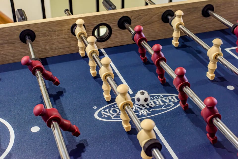 Loft Game Lounge: Featuring a full-size Foosball table and a classic Pac-Man arcade, this cool attic space also offers a daybed for extra guests!