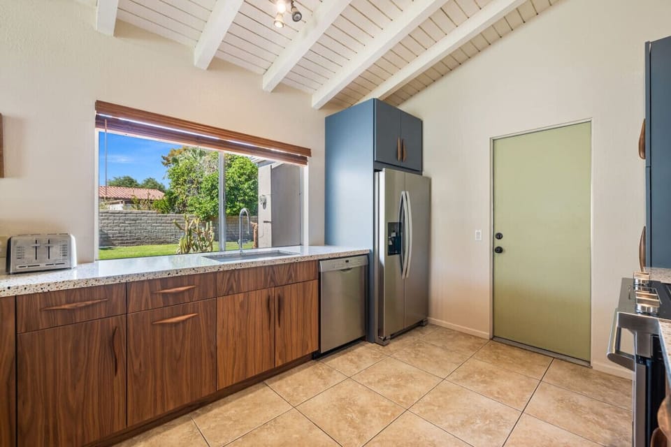 A kitchen designed for cooking with a view — indoor/outdoor living at its best.