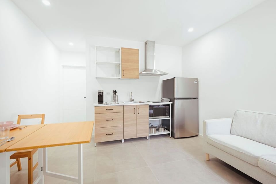 Cook up comfort and convenience in this modern, fully-equipped kitchen — perfect for whipping up your favorite meals during your stay! Enjoy sleek appliances, ample storage, and a bright, open space designed for both relaxation and functionality.