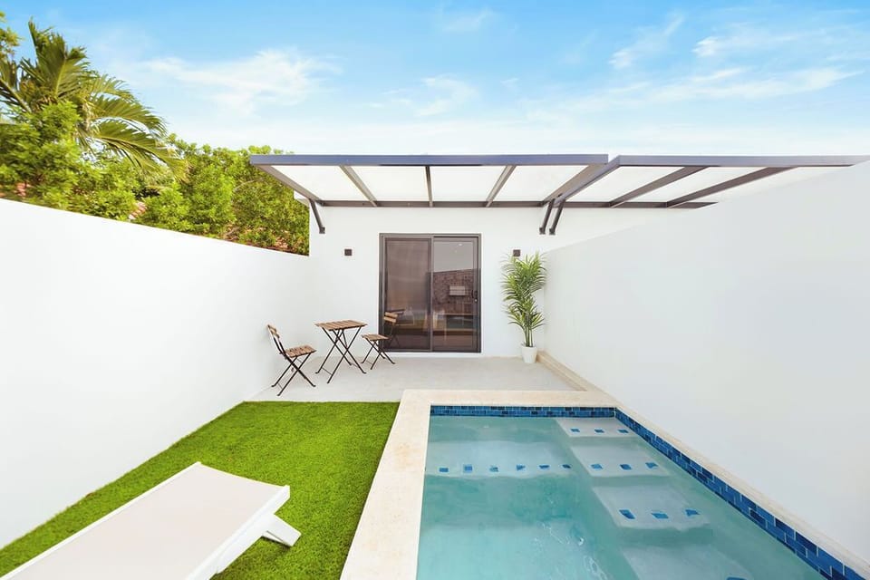Step out your sliding glass door to your own patio with direct access to a refreshing mini-pool/dipping area and a charming bistro set for morning coffee.
