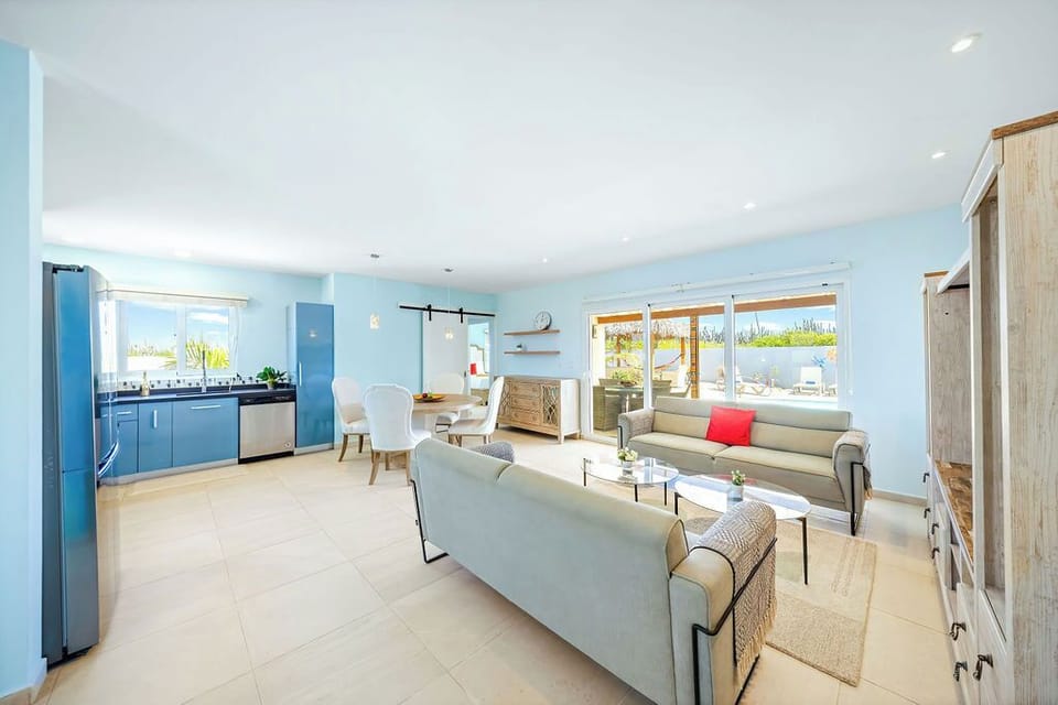 Step into a world of tropical comfort and modern style in our stunning open-concept living area!