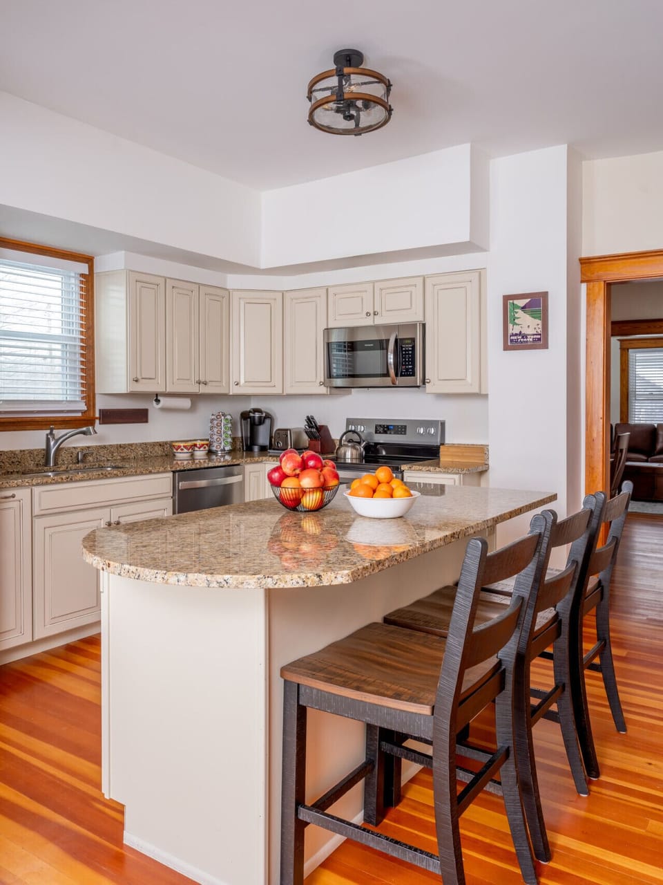 Full kitchen with stove and oven, large refrigerator, dishwasher, microwave