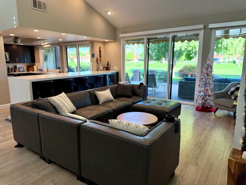 Bright, cozy living room with fairway views.