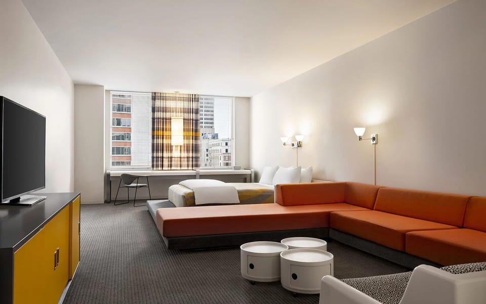 Unwind in a spacious suite with lounge seating and skyline views