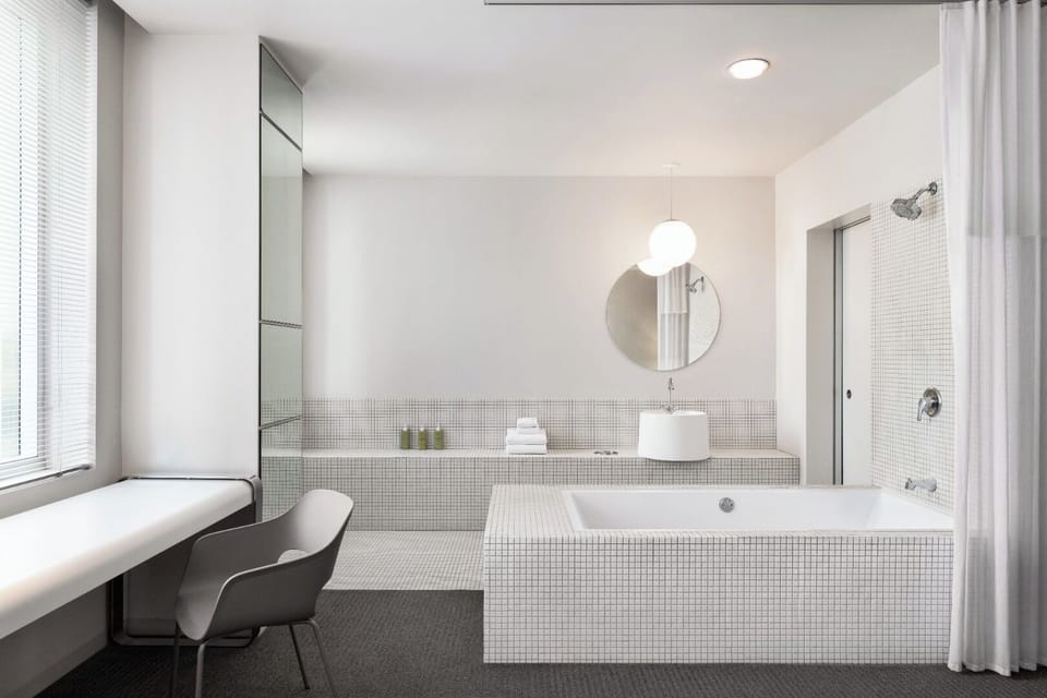 Indulge in a roomy bath featuring tub and walk-in shower.