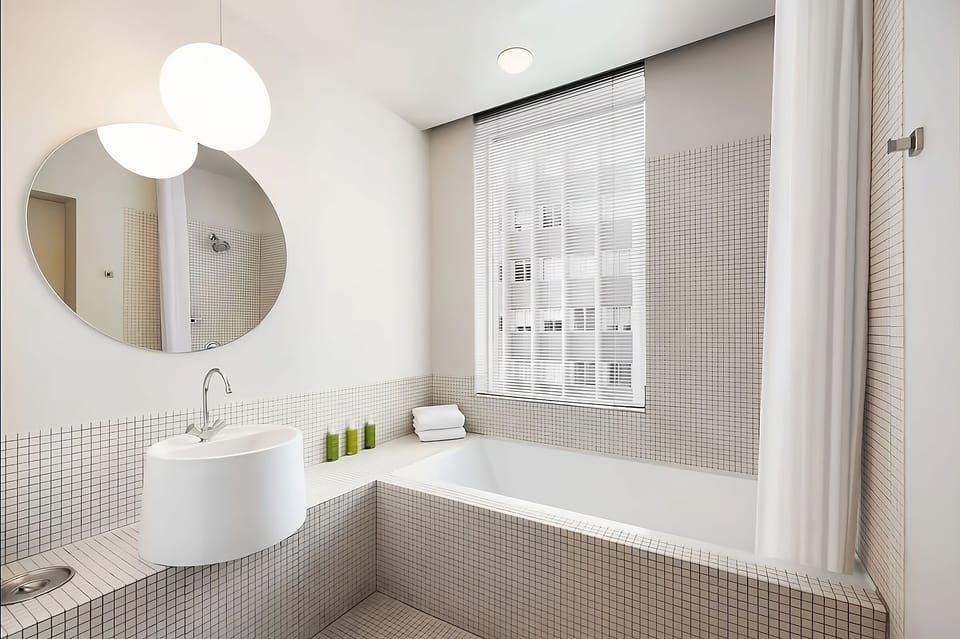 Refresh in a bright, spa-like bath with deep soaking tub.
