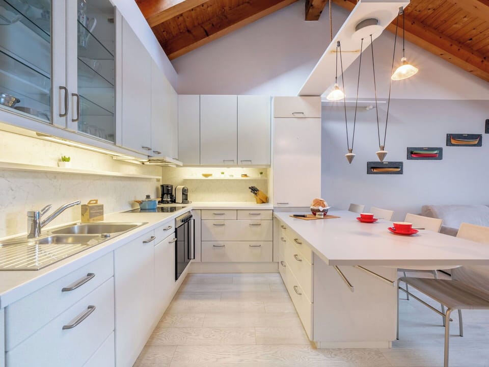 Kitchen, Countertop, Interior Design, Flooring, Furniture, Light Fixture, Kitchen Appliance, Cabinetry, Ceiling, Wood
