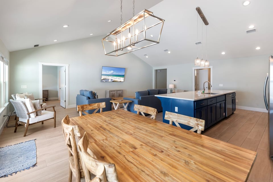 Gather around your spacious dining table while meals simmer in the gourmet kitchen, then unwind in the cozy living area.