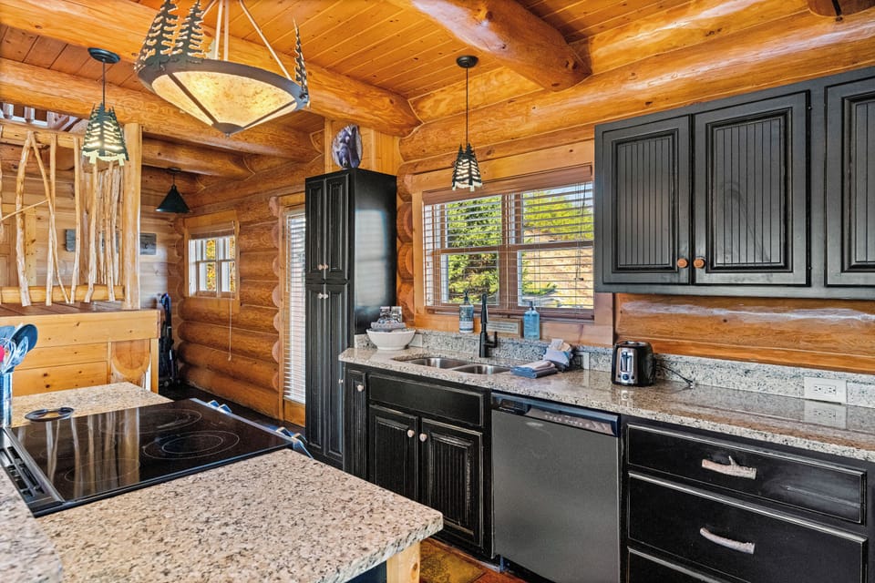Kitchen with rustic cabinetry & stainless appliances