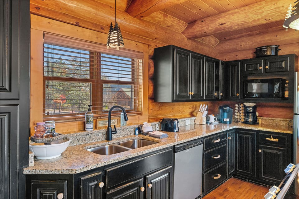 Kitchen with rustic cabinetry & stainless appliances
