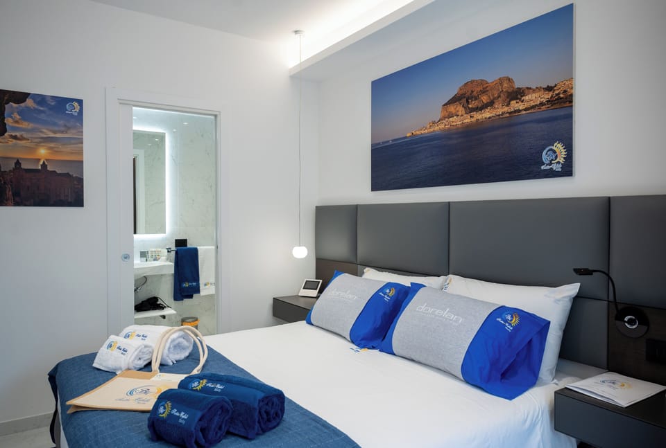Deluxe Double Room, Patio, Courtyard View | In-room safe, blackout drapes, soundproofing, iron/ironing board