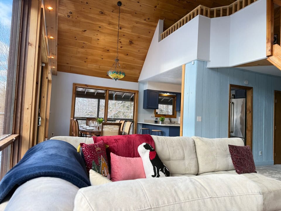 It’s the perfect spot to relax while taking in the wooded views through large windows.