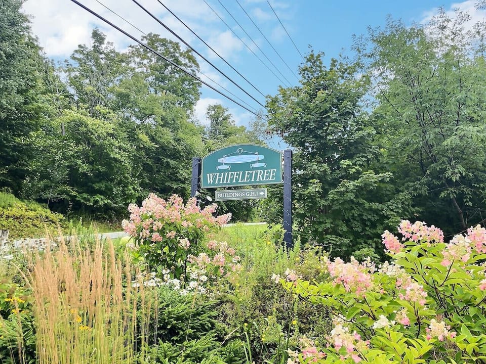 Welcome sign at the entrance of the property.