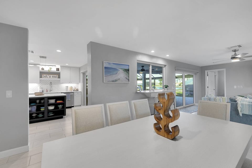 The dining area connects the living room and kitchen, making it easy to cook, dine, and socialize all in one bright, welcoming space.