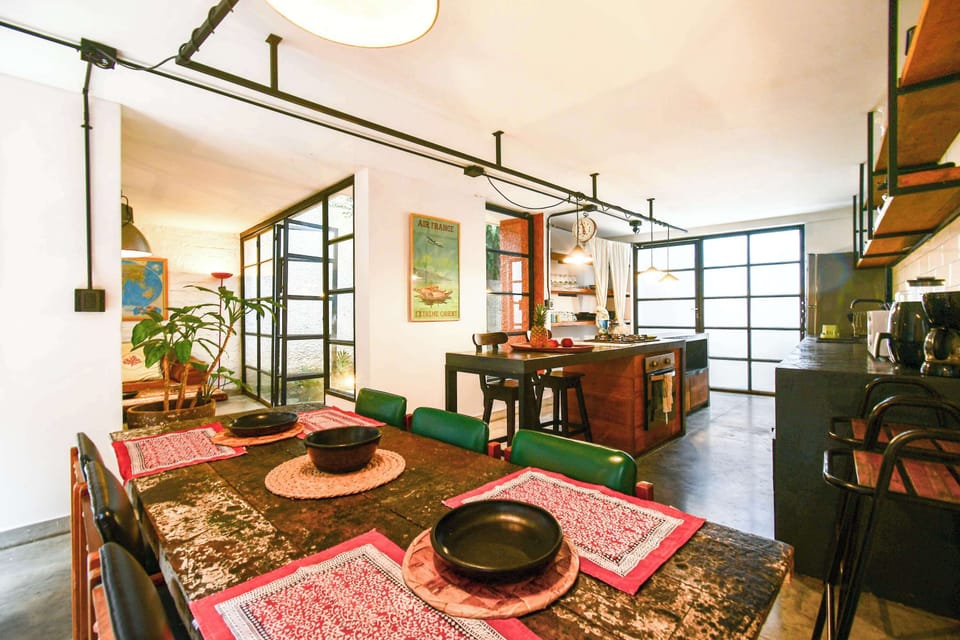 Fully equipped open kitchen with rustic details.