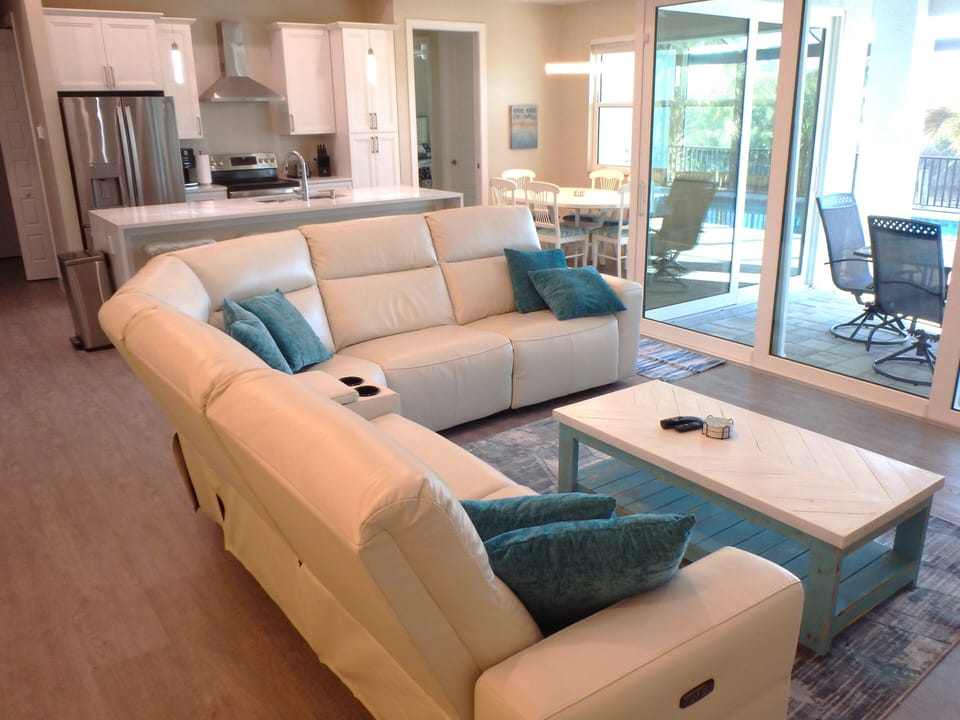 Airy Living Room with Sectional, Smart TV & Direct Lanai Access