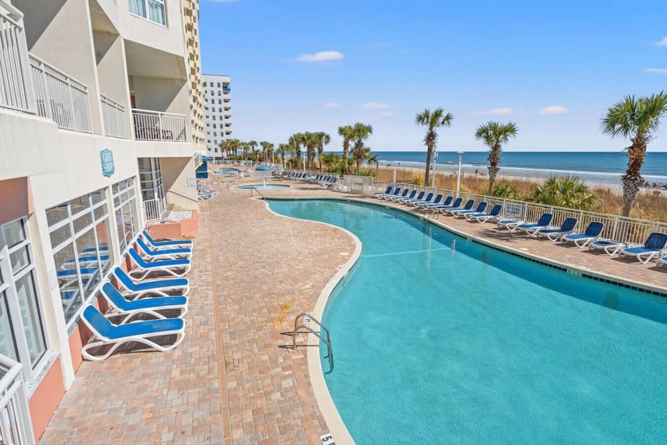 Seasonally heated outdoor pool located in front of Tower 2 at Bay Watch Resort. Enjoy refreshing swims, ocean breezes, and plenty of space to relax while soaking in the beachfront atmosphere.