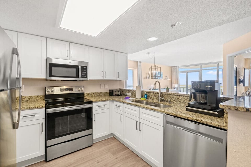 Fully equipped kitchen at Bay Watch Resort with everything needed for comfortable vacation living. Ideal for cooking meals, prepping snacks, and enjoying a home-away-from-home experience in this North Myrtle Beach oasis.