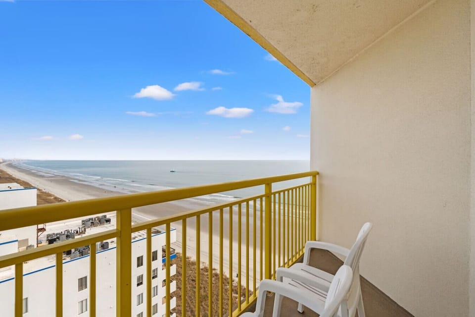 Private guest bedroom balcony with direct ocean views overlooking the North Myrtle Beach shoreline. A peaceful retreat to enjoy fresh coastal air, scenic views, and relaxing moments just steps from your room.