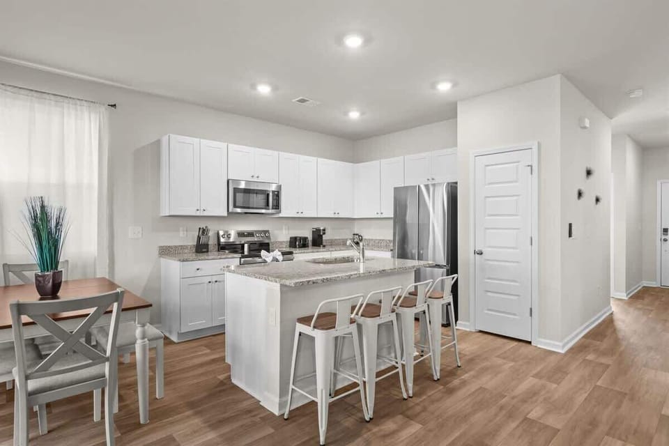 Open-concept flow from kitchen to dining—great for hosting