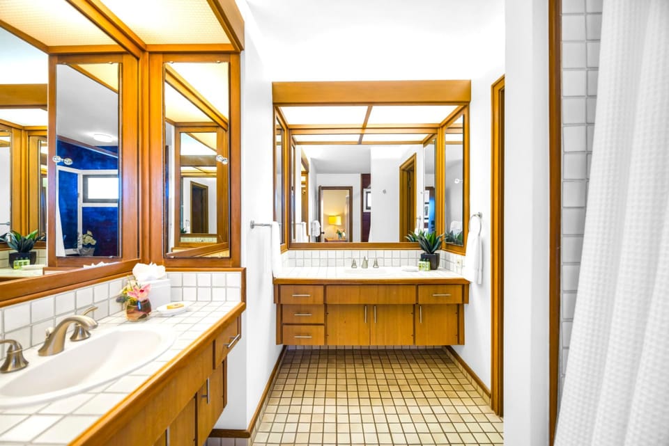 The primary bath offers dual sinks, a soaking tub, and walk-in shower for added comfort and convenience.