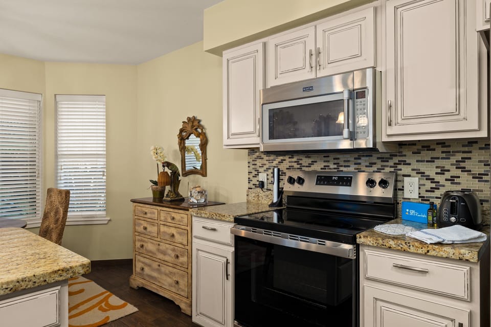 Cook with ease using stainless steel appliances and ample storage