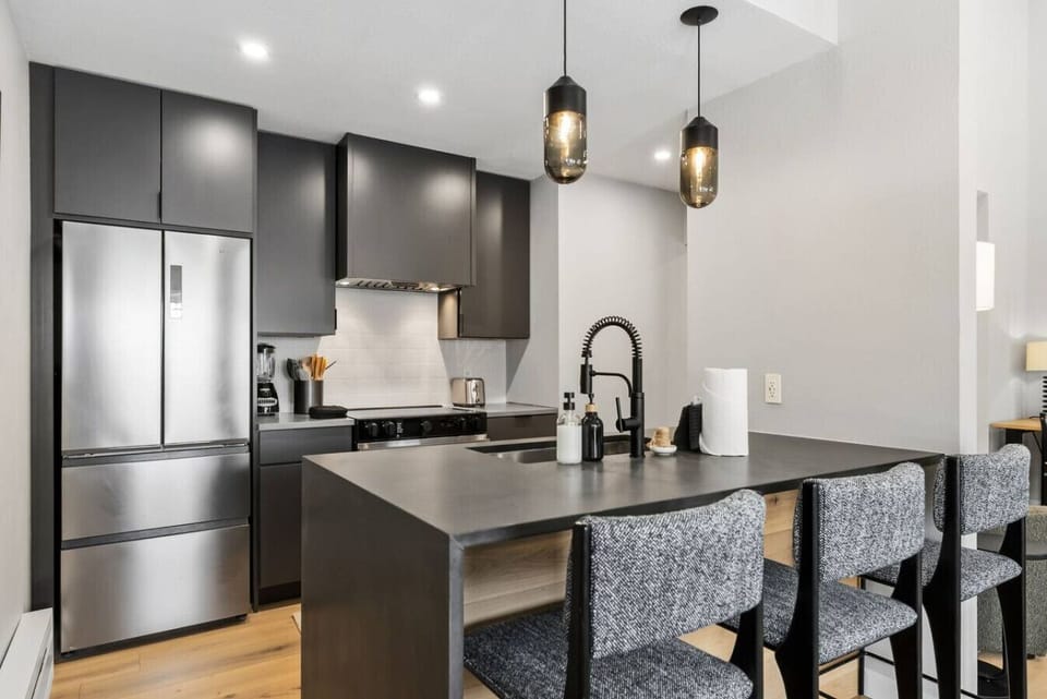 Freshly renovated and fully equipped kitchen with bar seating