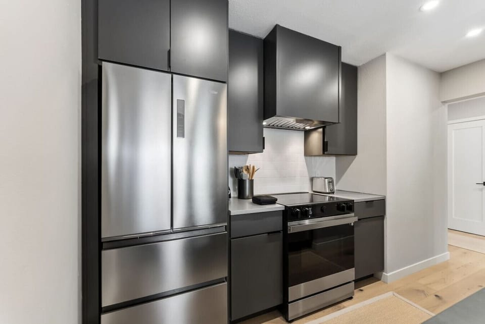 Freshly renovated and fully equipped kitchen with bar seating