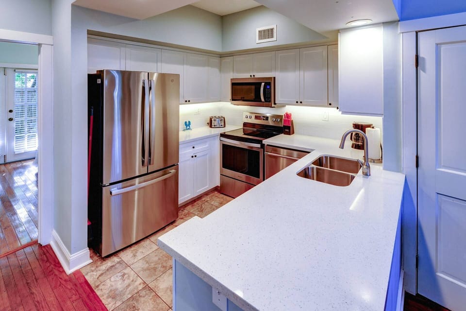 The updated kitchen makes meal prep a pleasure, offering a bright and modern space to cook and gather.