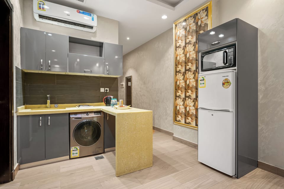 Fridge, microwave, electric kettle, cookware/dishes/utensils