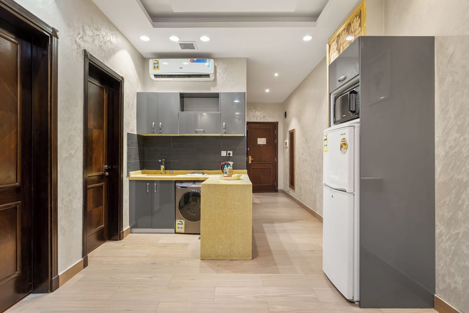 Fridge, microwave, electric kettle, cookware/dishes/utensils