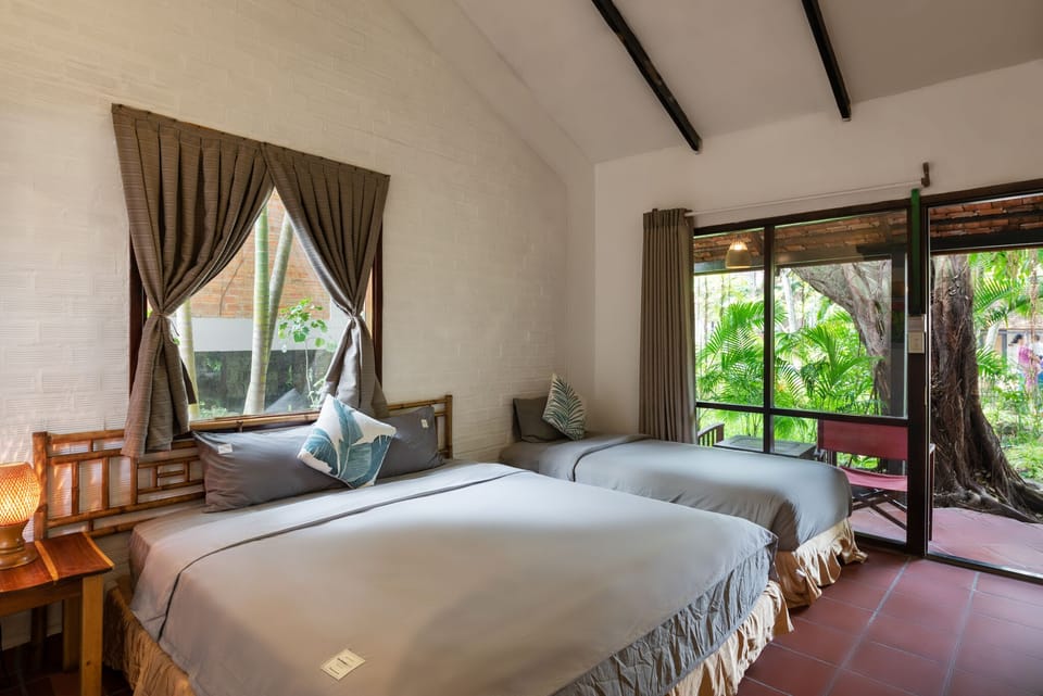 Deluxe Triple Room | Minibar, in-room safe, desk, free WiFi