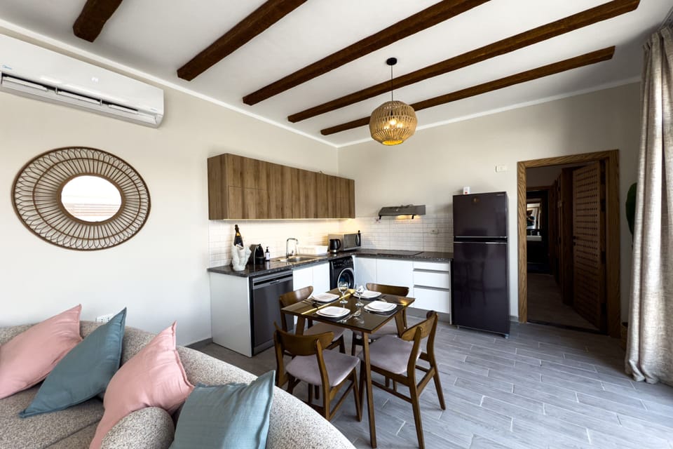Basic Villa | Living area | 55-inch TV with cable channels
