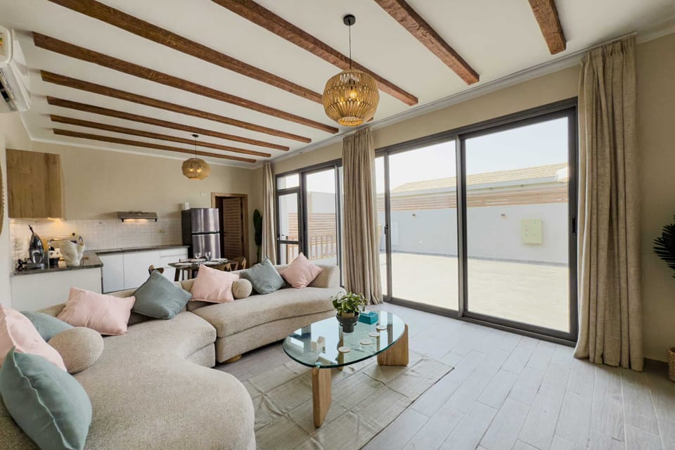 Basic Villa | Living area | 55-inch TV with cable channels