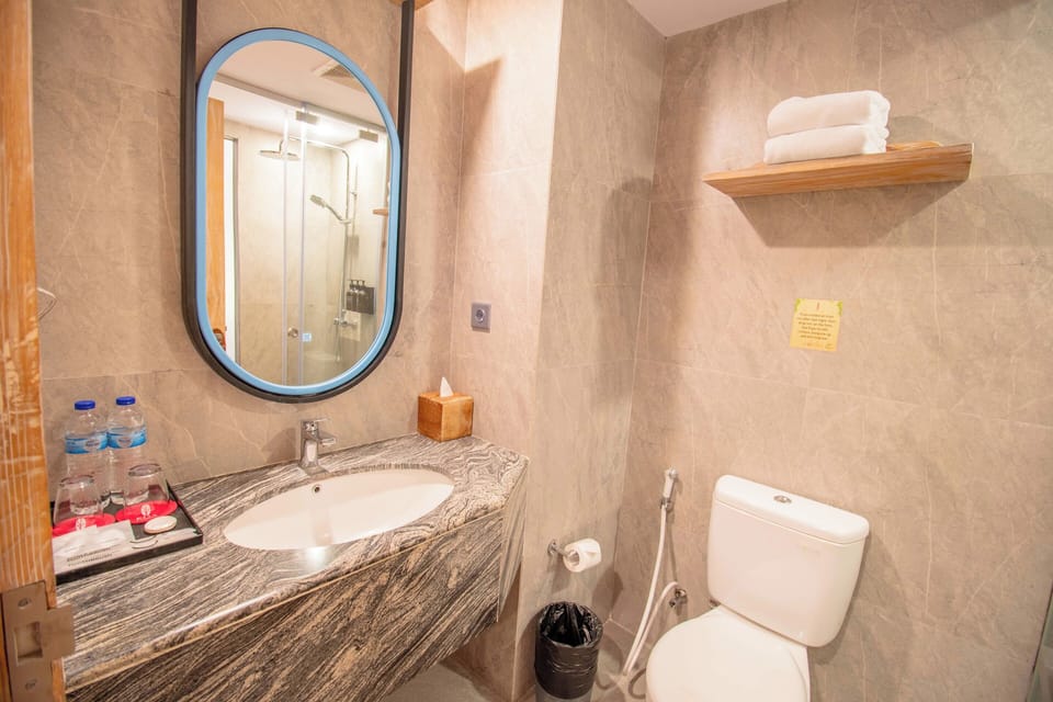 Shower, free toiletries, hair dryer, slippers