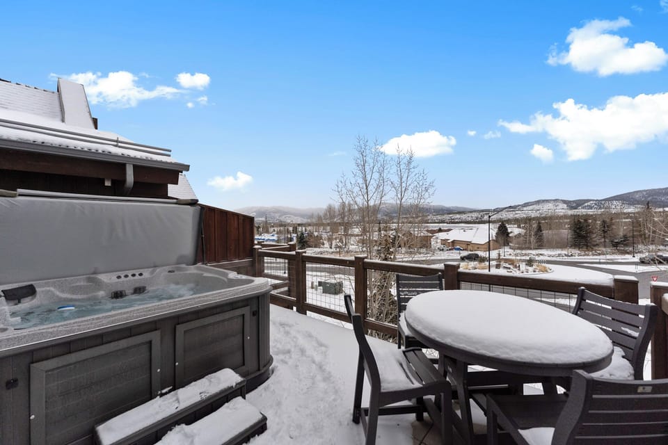 Soak in your private hot tub while gazing at snow-capped mountains from your deck, complete with outdoor dining for alpine evenings.
