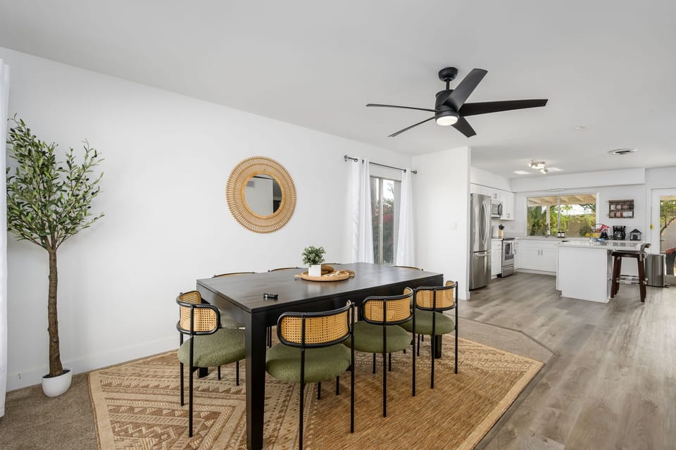 Designed for connection, this open dining area flows seamlessly into the kitchen—making hosting, cooking, and conversation effortless.