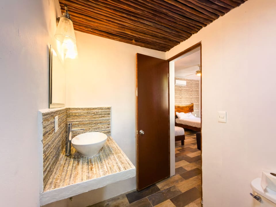 Deluxe Quadruple Room, Garden View | Bathroom | Shower, towels, soap, shampoo