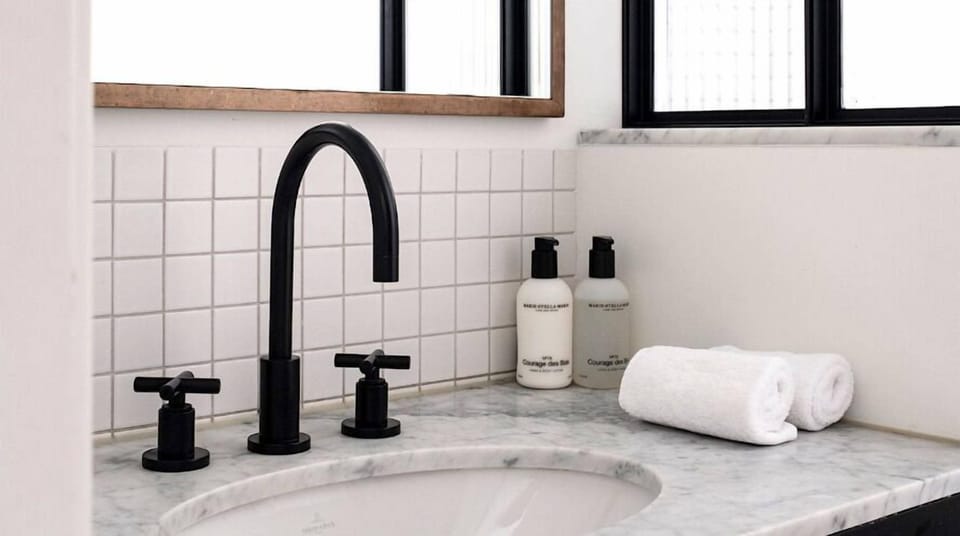 The Cute One | Bathroom | Shower, rainfall showerhead, designer toiletries, hair dryer