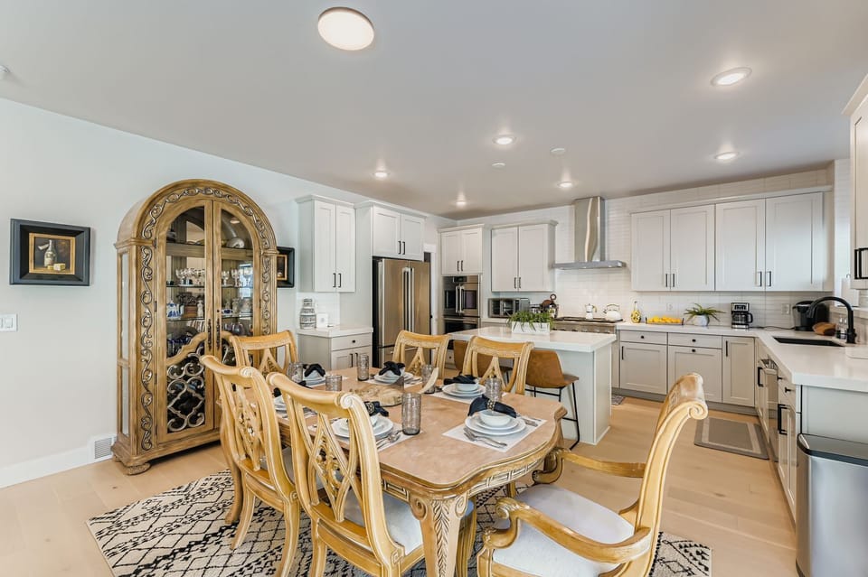 Your elegant dining space flows seamlessly into the fully equipped kitchen, creating the perfect setting for memorable meals and conversations with family and friends.