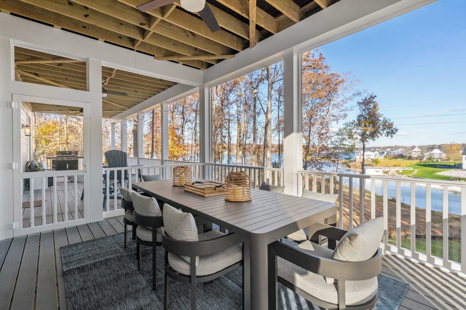 Dinner with a View - The outdoor dining table from another angle, with the lake visible through the autumn trees.