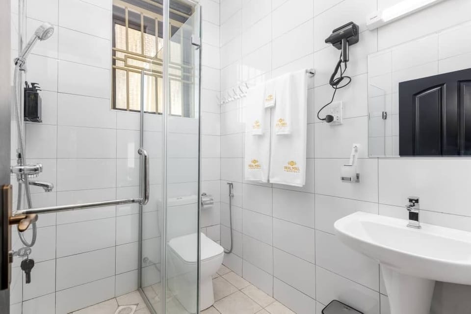 Separate tub and shower, free toiletries, hair dryer, slippers