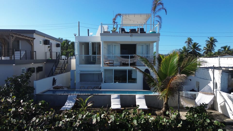 Rear of the villa with direct beach access and oceanfront infinity pool