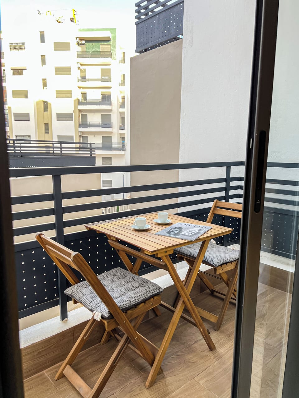 Spacious balconies overlook the garden, perfect for coffee, reading, or work.